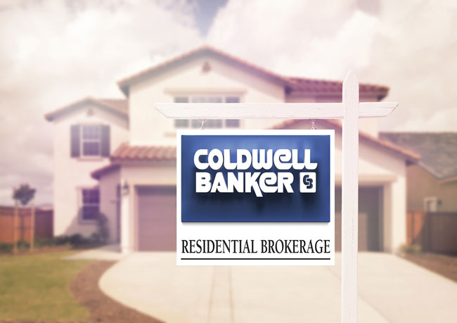 Coldwell Banker for sale sign in front of house