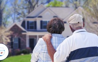 Featured Image - Senior couple in front of new home